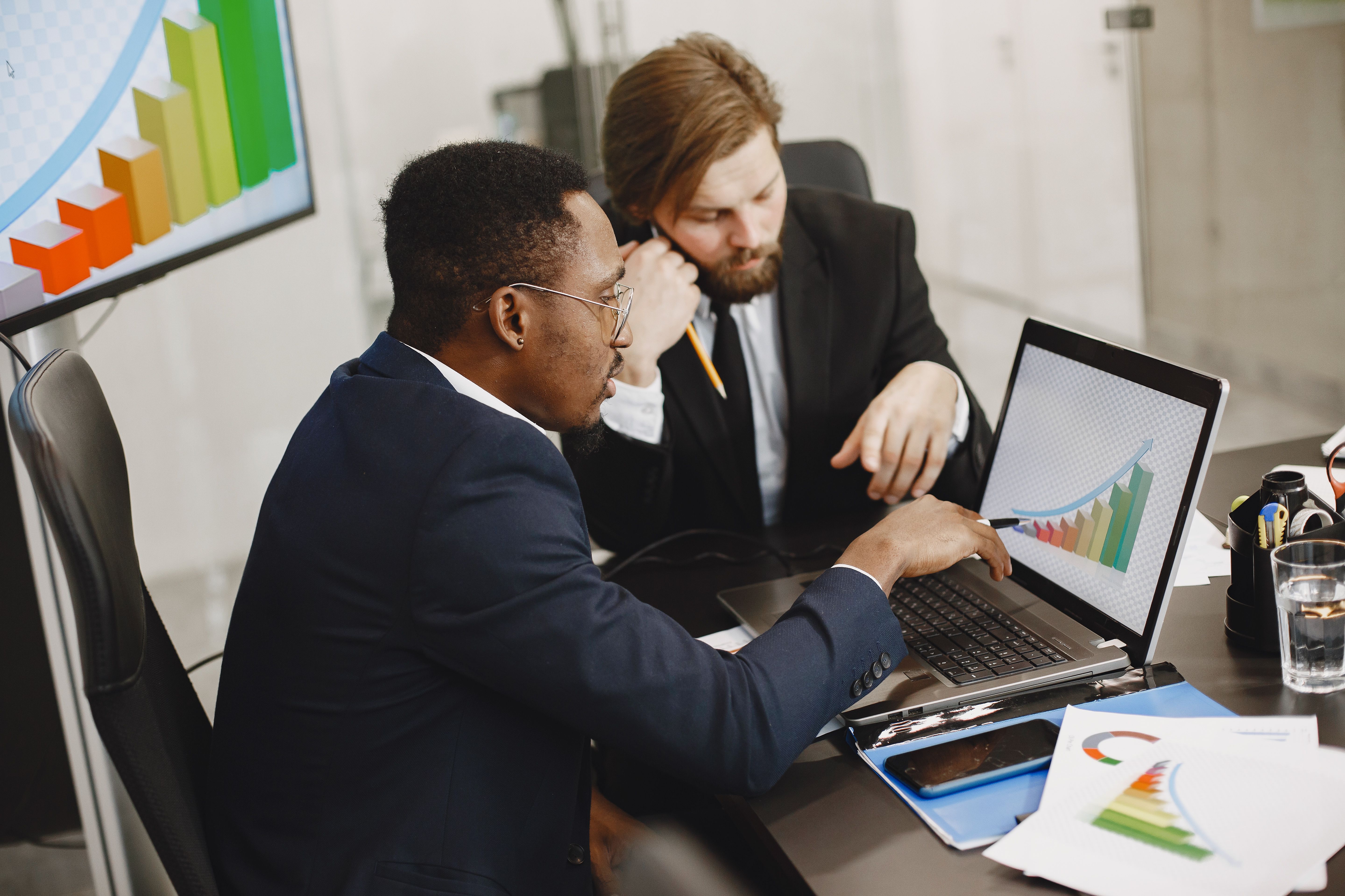 Business professionals reviewing financial strategy