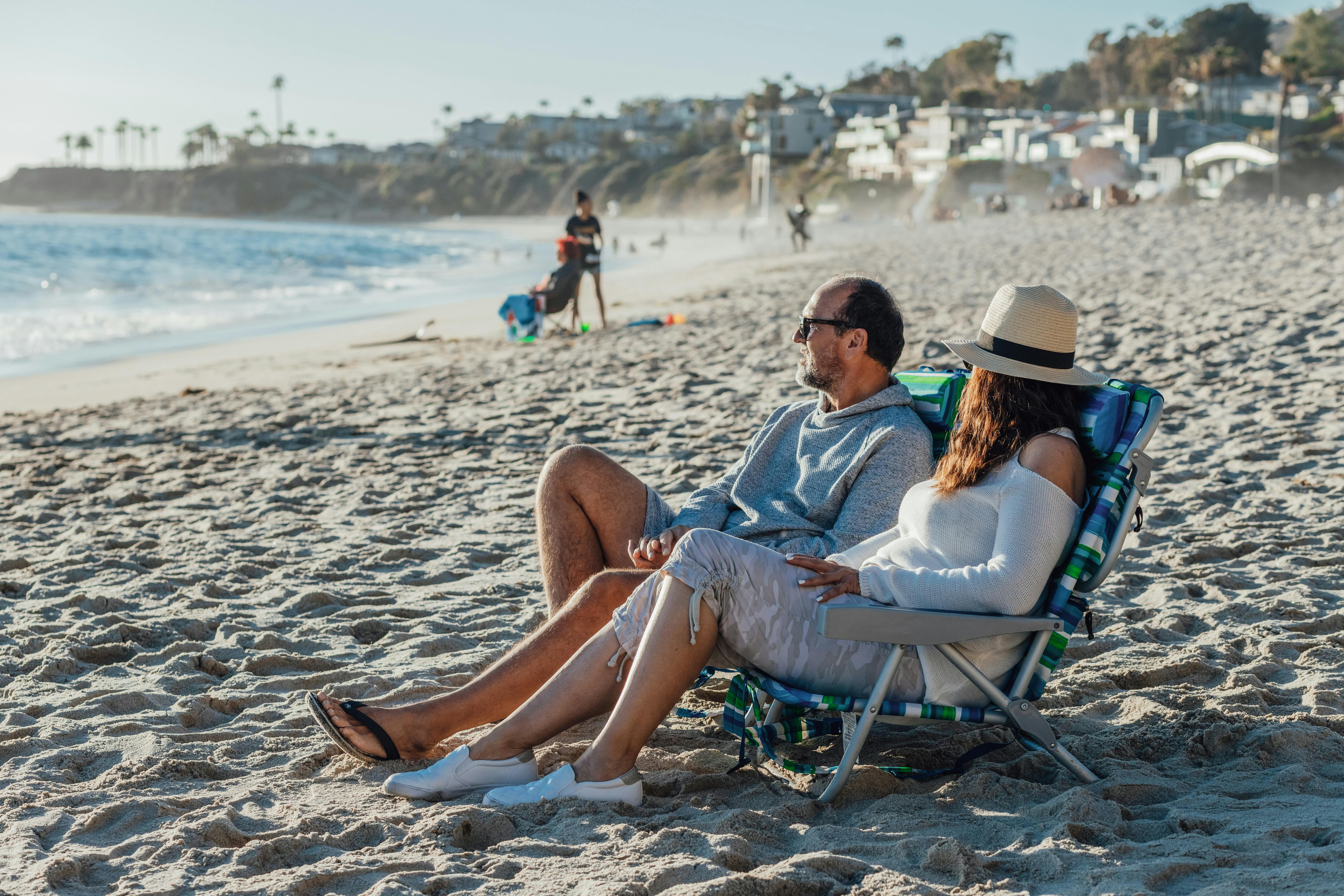 Retired couple relaxing on the beach